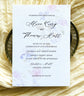 Wedding invitation card with  soft, watercolour floral design on textured paper
